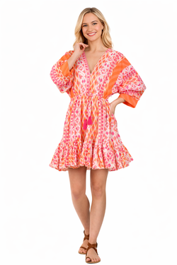 Coral vibrant ikat tribal print with ombre coral-pink-orange gradi Tiered Boho Mini Dress — close-up of print & trim | Who...