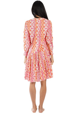 Coral vibrant ikat tribal print with ombre coral-pink-orange gradi Tiered Boho Mini Dress — back view | Caribbean boutique...