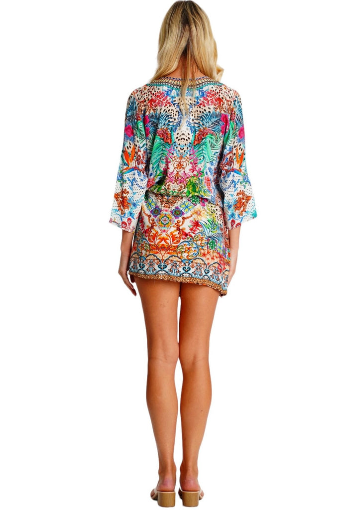 Wholesale vibrant multicolor print long-sleeve V-neck tunic mini dress with drawstring waist for resort boutiques - La Moda Clothing
