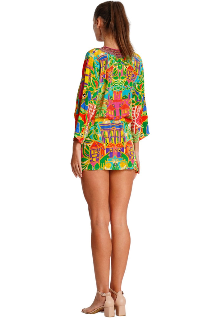 Wholesale tropical yellow orange and green print V-neck tunic mini dress with ruffled hem for resort retailers - La Moda Clothing