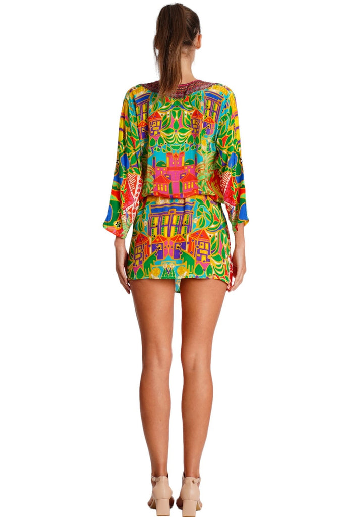 Wholesale tropical yellow orange and green print V-neck tunic mini dress with ruffled hem for resort retailers - La Moda Clothing