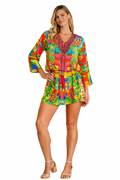 Wholesale tropical yellow orange and green print V-neck tunic mini dress with ruffled hem for resort retailers - La Moda Clothing