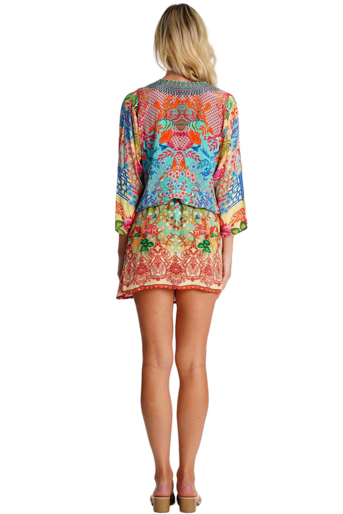 Wholesale blue orange and pink print V-neck tunic mini dress with 3/4 sleeves and drawstring waist - La Moda Clothing