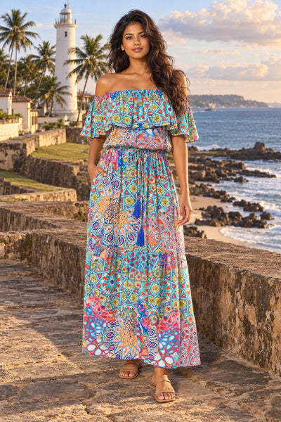 River Bed long off the shoulder maxi dress in multicolor mosaic print with ruffle top and tassel tie, front view at Galle Fort - La Moda wholesale