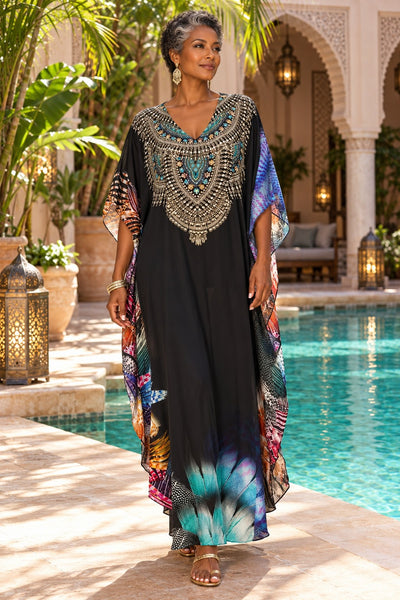Black lightweight maxi caftan dress cover-up with gold jeweled medallion neckline, front view on model at Marrakech riad pool - La Moda wholesale resort wear