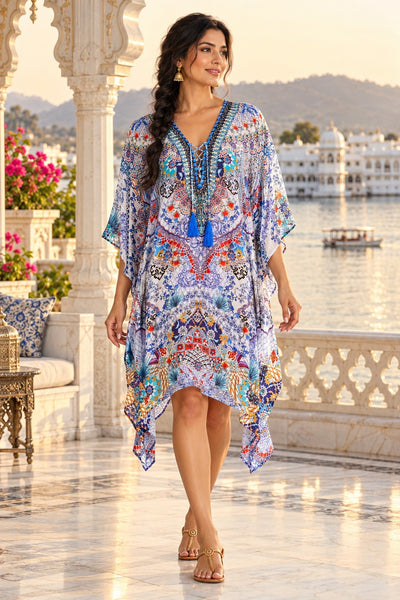 Lavender and coral paisley designer kaftan with embellished lace-up neckline and tassels, front view on Udaipur palace terrace - wholesale caftans