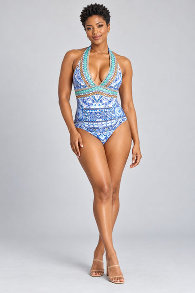 Blue and white Mediterranean tile print plunge halter one-piece swimsuit with embellished trim, front view - wholesale swimwear