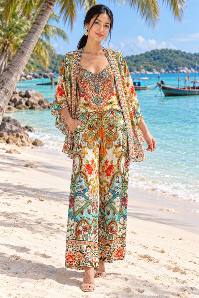 Cream and red poppy floral print open kimono cape styled over matching set, front view on model at Phu Quoc beach - La Moda wholesale resort wear
