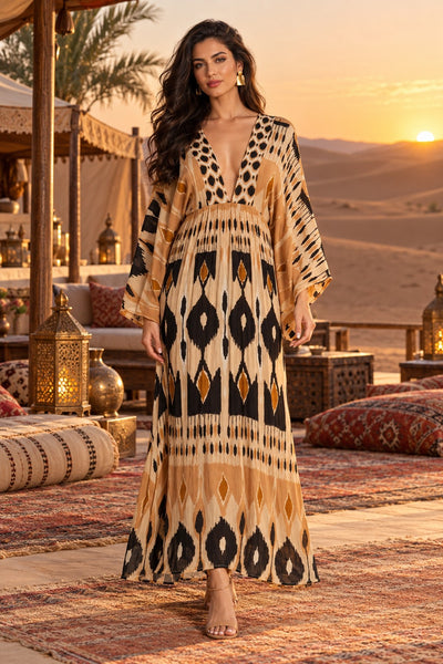 Camel and black ikat print kaftan sleeve V-neck maxi dress, front view at Marrakech desert camp - wholesale summer maxi dresses